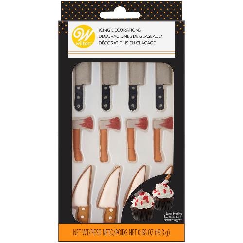 A package of assorted knife and cleaver royal icing decorations by Wilton. The package contains 12 pieces, featuring various designs of knives and cleavers made from royal icing, used for decorating cakes and baked goods. The decorations are arranged on a neutral background, showcasing their intricate details and vibrant colors