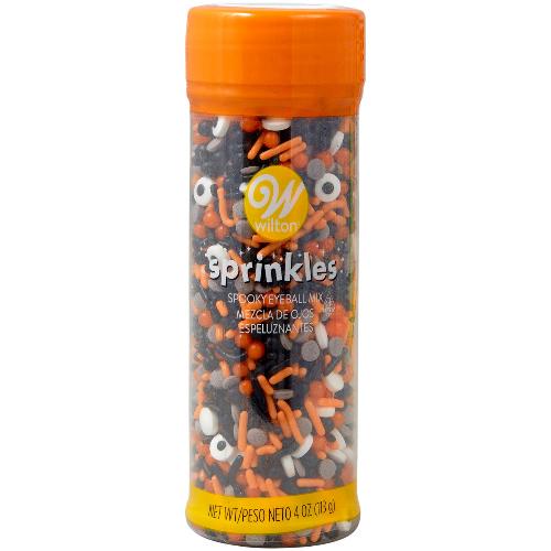 A 4-ounce container of Spooky Eyeball Mix Sprinkles by Wilton. The mix includes various sprinkles shaped like eyeballs, with colorful, spooky designs perfect for decorating Halloween treats and adding a playful, eerie touch